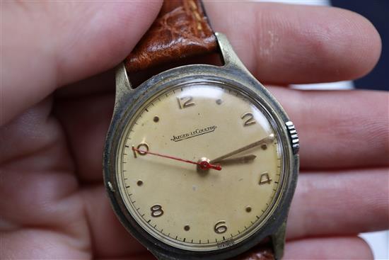 A gentlemans Jaeger Le Coultre wristwatch with red seconds hand, dated 1950 and a Bucherer gold plated